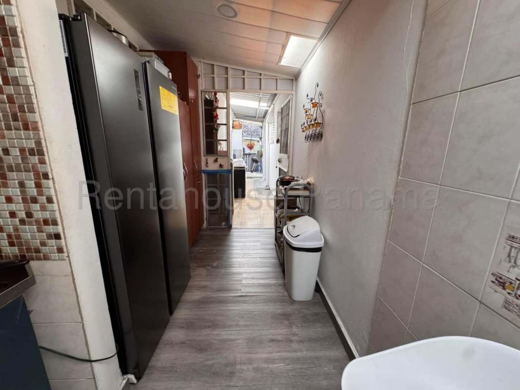 Large outdoor terrace with barbecue area and seating Villa Lucre Panama