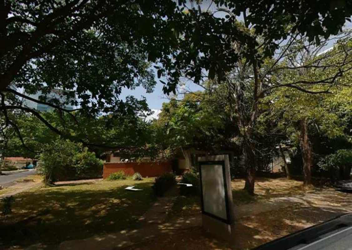 Exterior view of garden space and trees on large city lot in Obarrio Panama for redevelopment