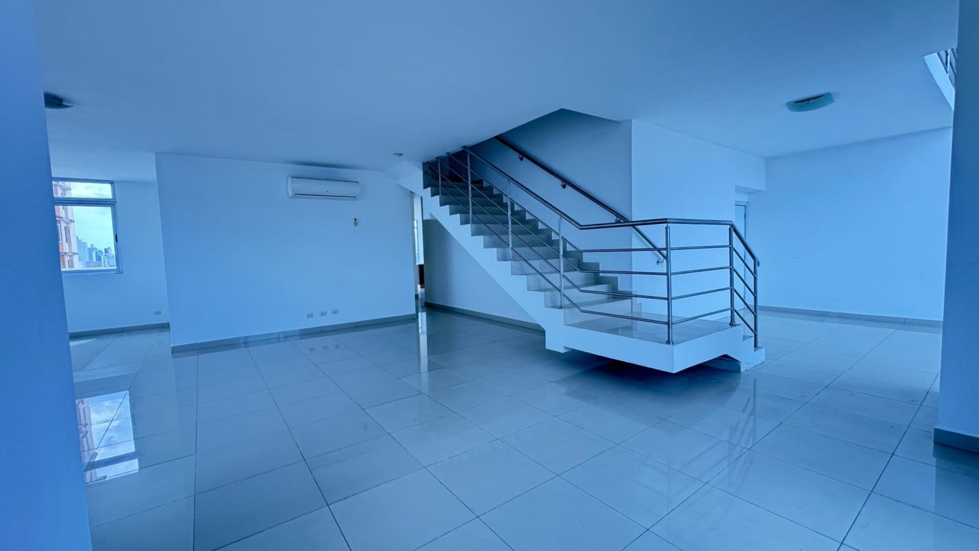 Spacious bedroom with walk-in closet, large window at PH Astoria Panama