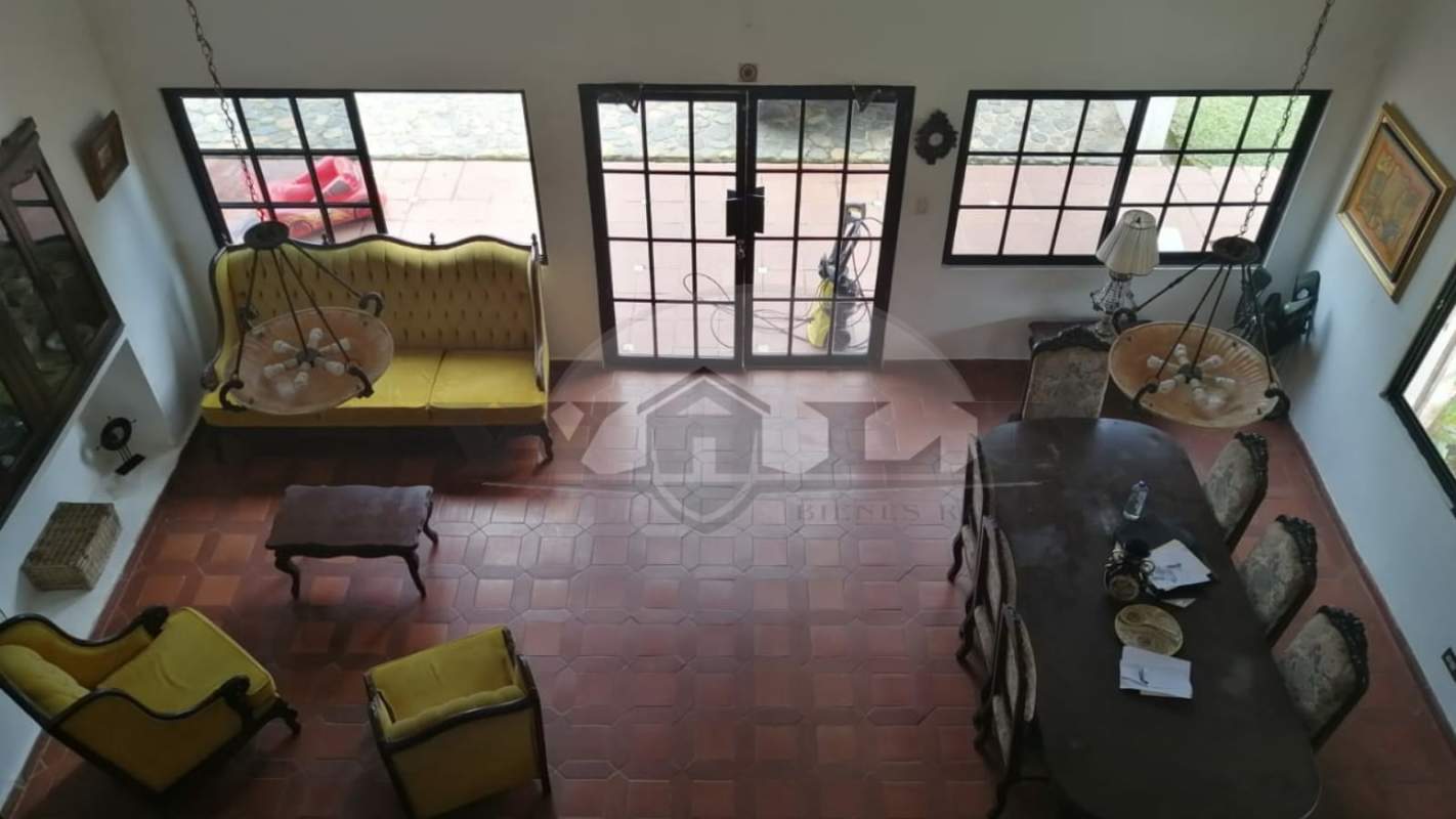 Bathroom with tile walls, wood ceiling, pedestal sink in Altos de Cerro Azul Panama