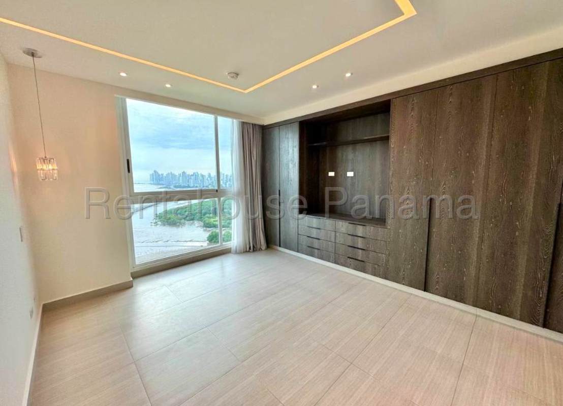 Bedroom with large window ocean view closet tile floors in PH Asia Costa del Este Panama