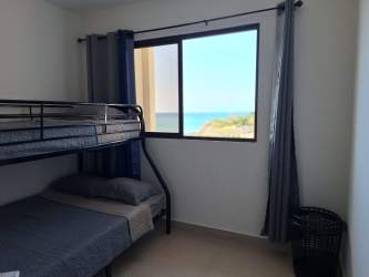 Beachfront pool and recreational amenities at PH Playa del Sol