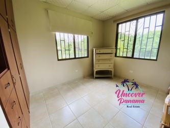 Living area with tiled floors, large windows, natural light in Santa Clara Panama beach home