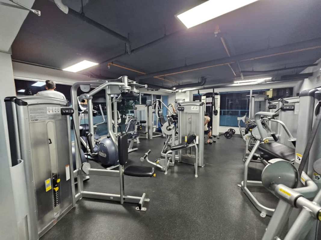 Modern gym with cardio machines and weights in Vista Park Tower Panama City