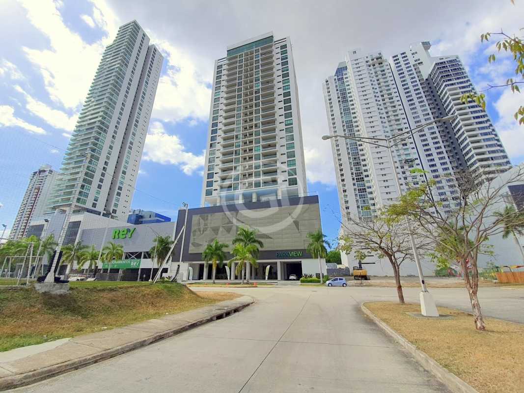 Spacious modern apartment kitchen with granite counters, view to ocean and city skyline in PH Park View Costa del Este Panama