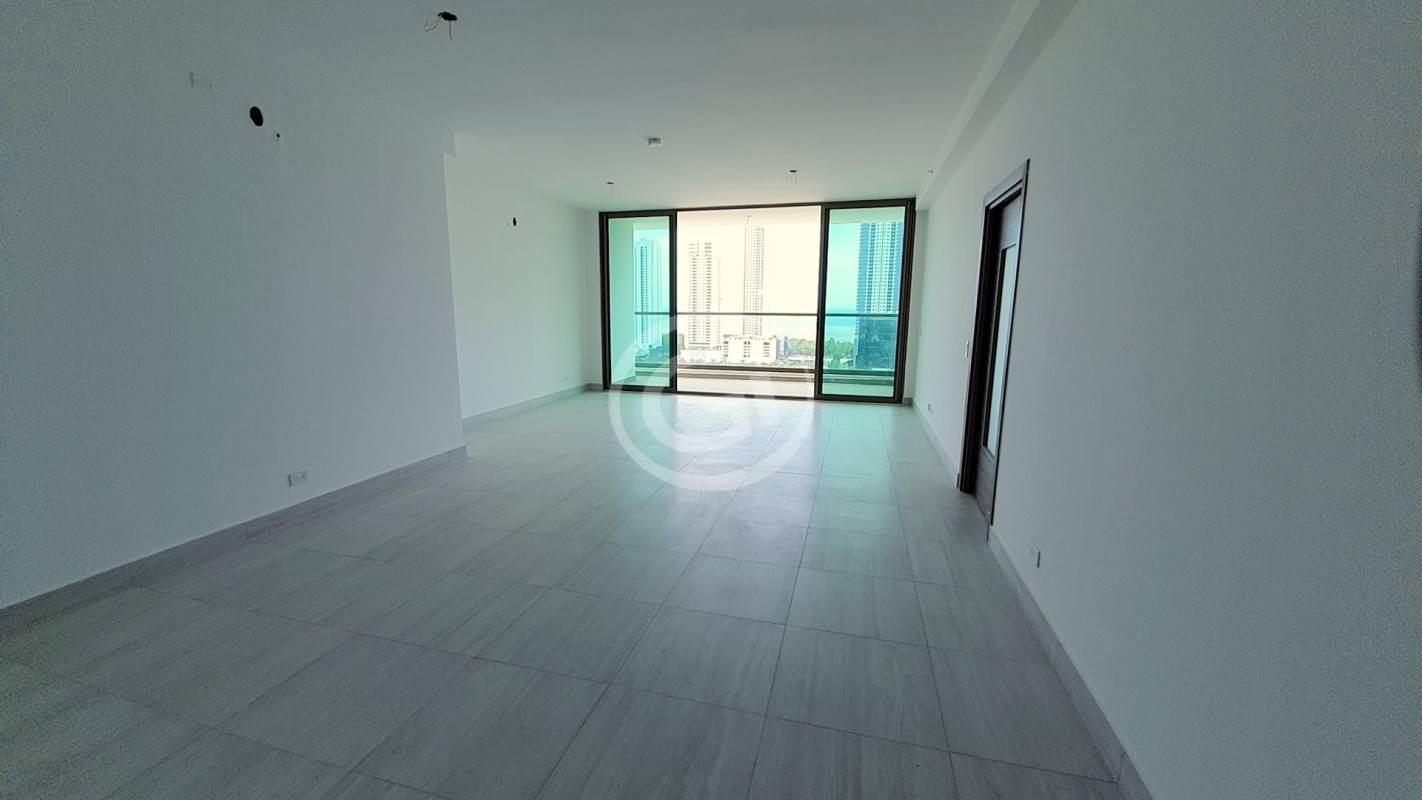 Balcony with glass railing overlooking ocean and Panama City skyline at Park View Costa del Este