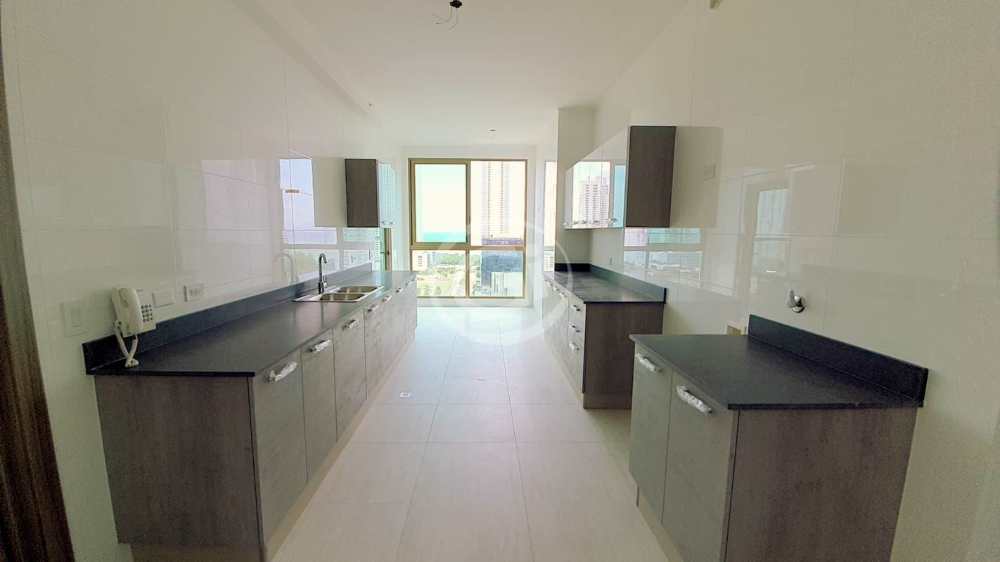 Aerial of Costa del Este Panama cityscape with skyscrapers and ocean coastline, PH Park View location