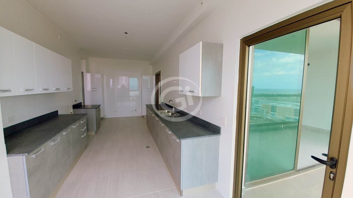 Bright game room with colorful mural wall, ping pong and foosball tables in PH Park View tower Panama