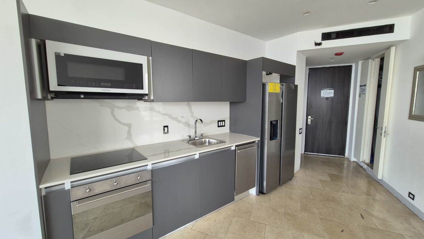 Bedroom with balcony access, skyline and ocean views at JW Marriott Panama