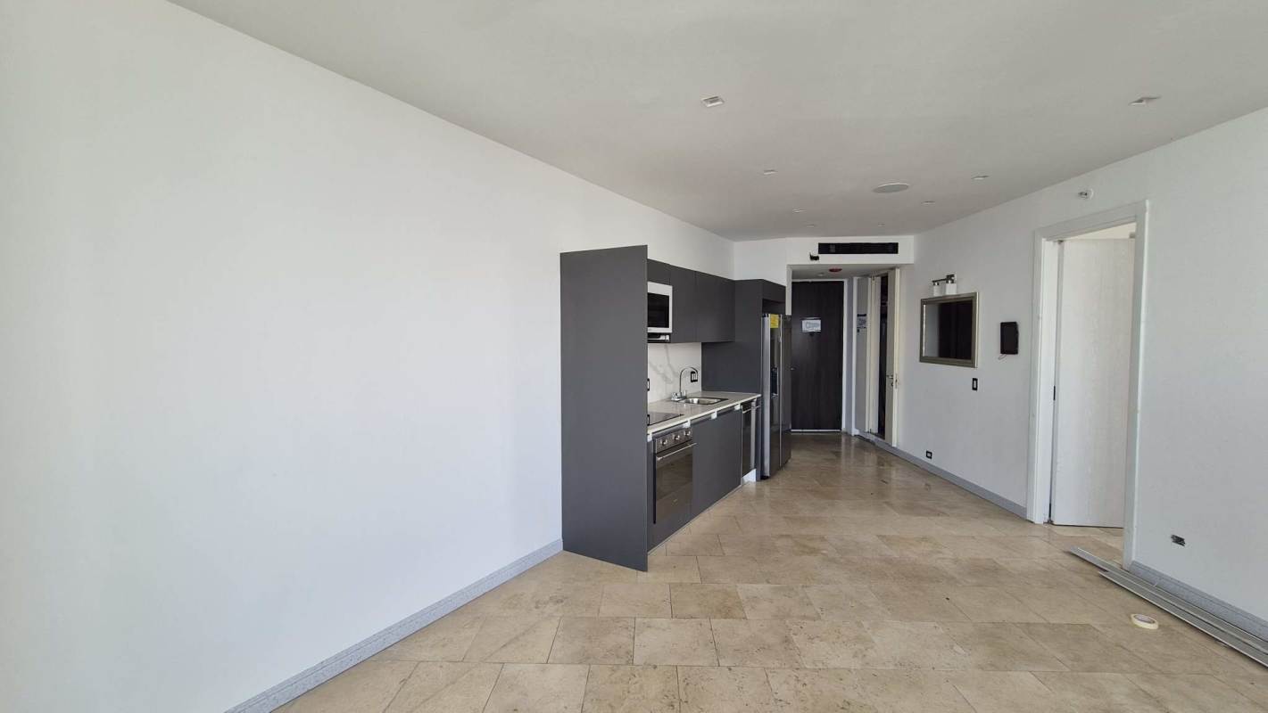 Open kitchen with granite counters stainless appliances at Punta Pacifica JW Marriott