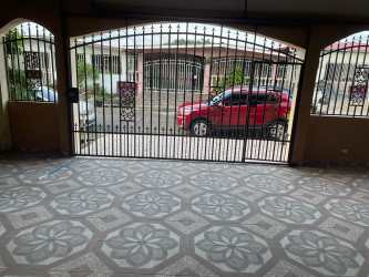 Bedroom with folding wooden doors built-in wardrobe mirror panel tiled floor Vacamonte Panama