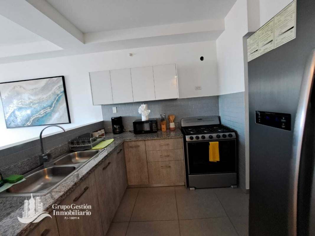 Modern bathroom with glass-enclosed shower, vanity and tile at PH Signature Point Panama