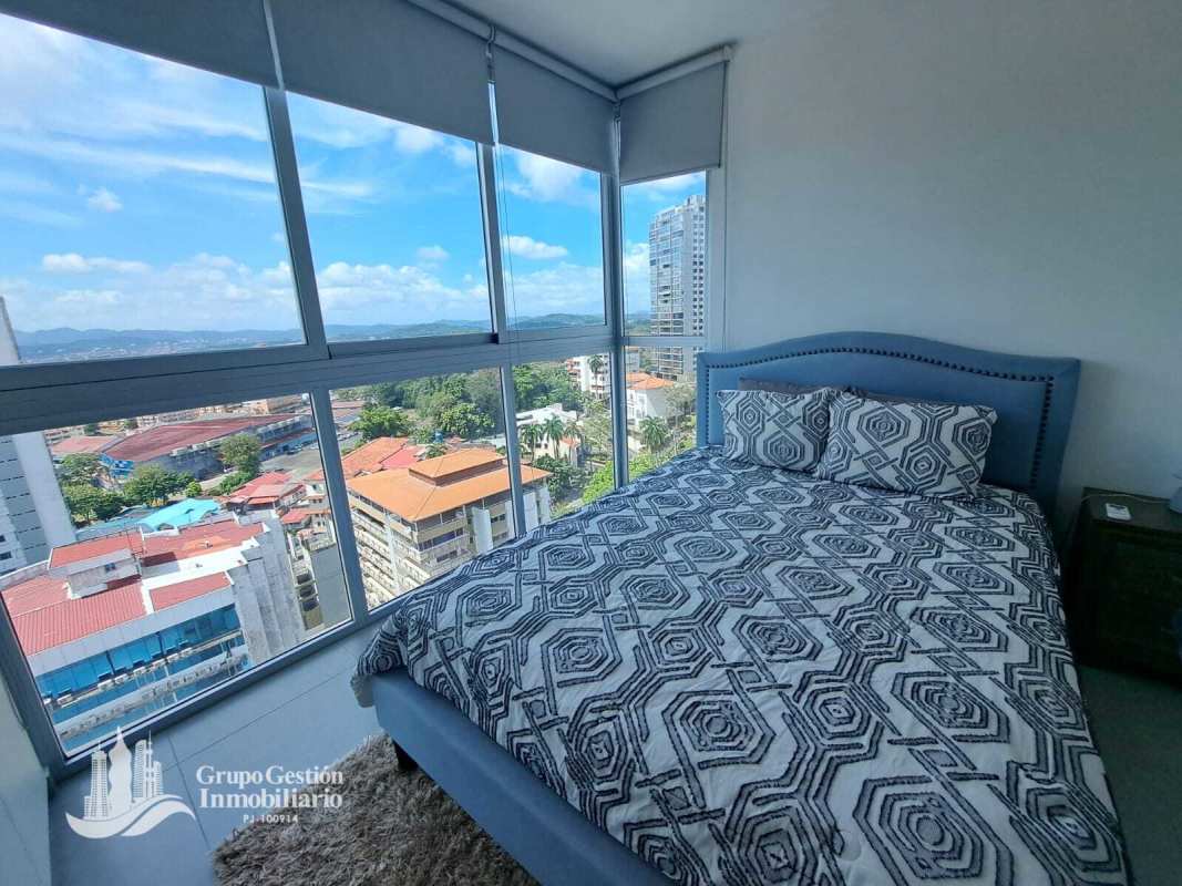 Bedroom with large window city views, AC and closet in PH Signature Point Panama City apartment