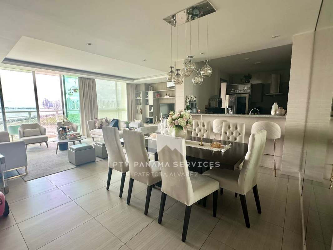 Dining area with skyline views connected to spacious living room in PH Costa del Mar Panama