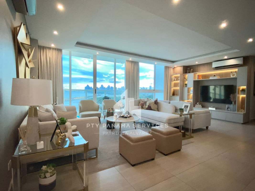 Contemporary living room with panoramic city and ocean views at Costa del Este Panama
