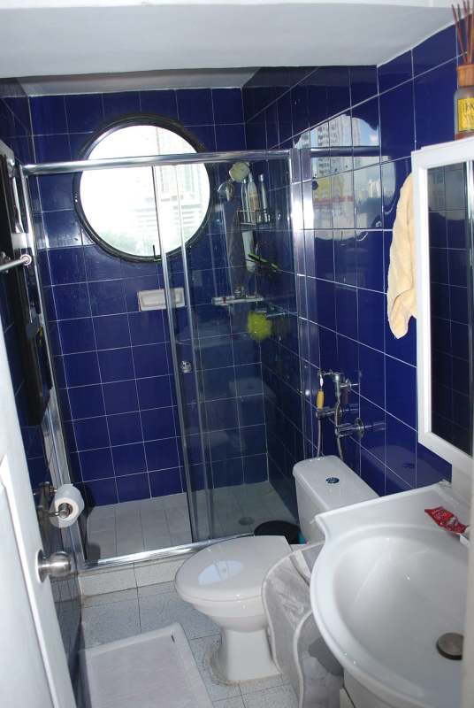 Bright kitchen with windows, gas stove, cabinets PH San Francisco Panama apartment for sale