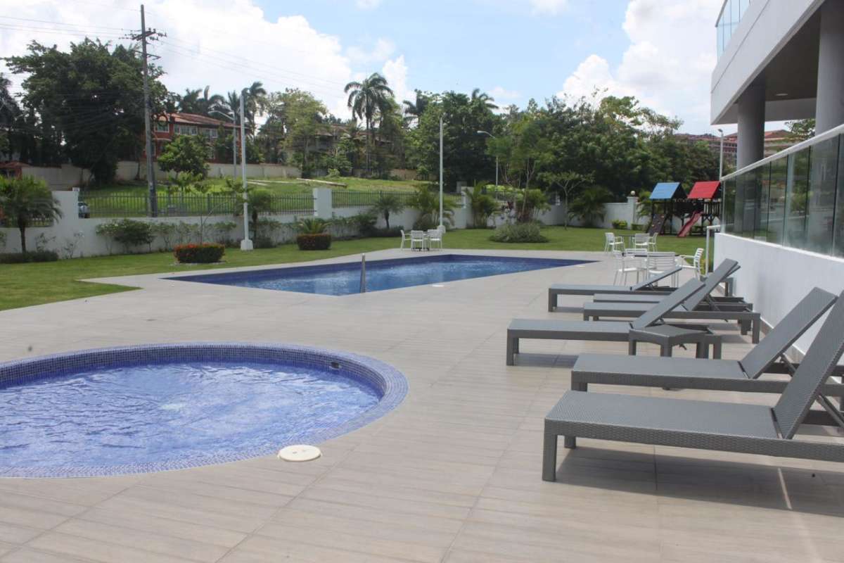 Pools with sun deck, playground in lush surroundings at PH Clayton Park II Ancon Panama