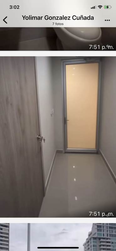 Corridor with frosted glass and wooden doors leading to private medical offices at Town Center Panama