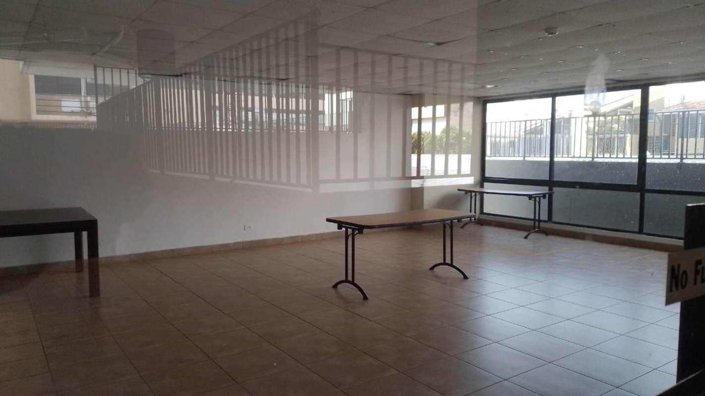 Empty multipurpose interior with windows tiled floor Panama City