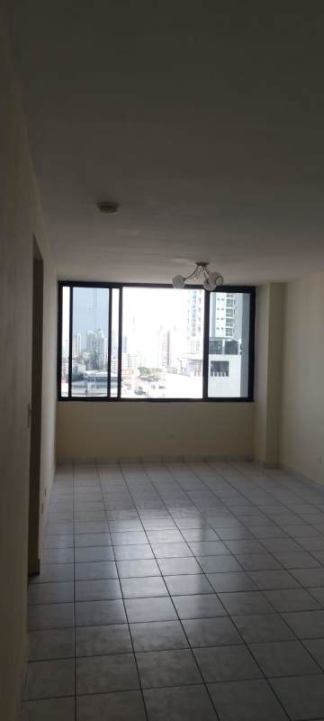 Living room with city view from large windows PH Torres del Sol Panama