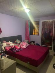 Spacious kitchen with dark cabinets, tile backsplash, double sink in house for sale Colón Panama