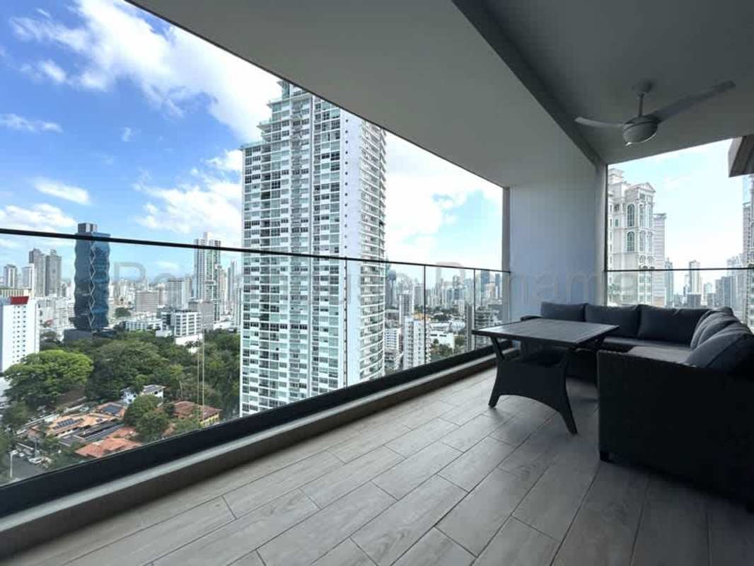Bright living room with panoramic windows ceramic floors in PH Prestige luxury condo Bella Vista Panama City