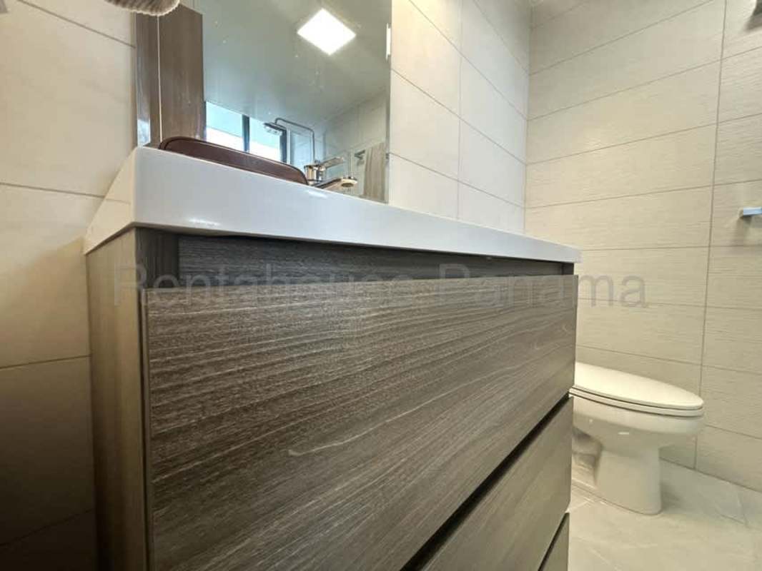 Modern bedroom with large windows and private bathroom PH Prestige Bella Vista Panama City