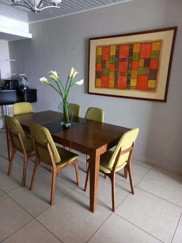 Dining room with city and ocean views, large windows in PH Rivage Avenida Balboa Panama