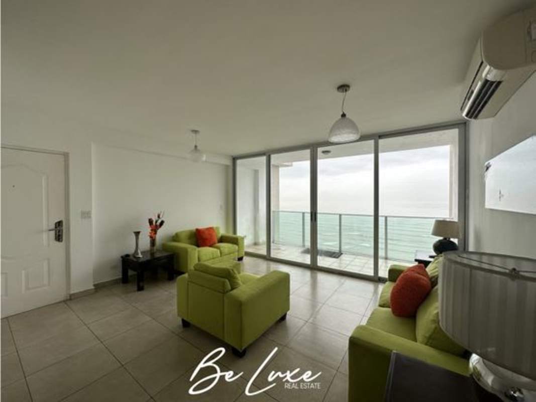 Living room with floor-to-ceiling windows and balcony at PH Terrasol, San Francisco Panama, ocean view apartment