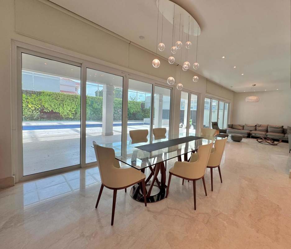 Elegant dining area with glass doors and marble flooring in luxury residence Costa del Este Panama
