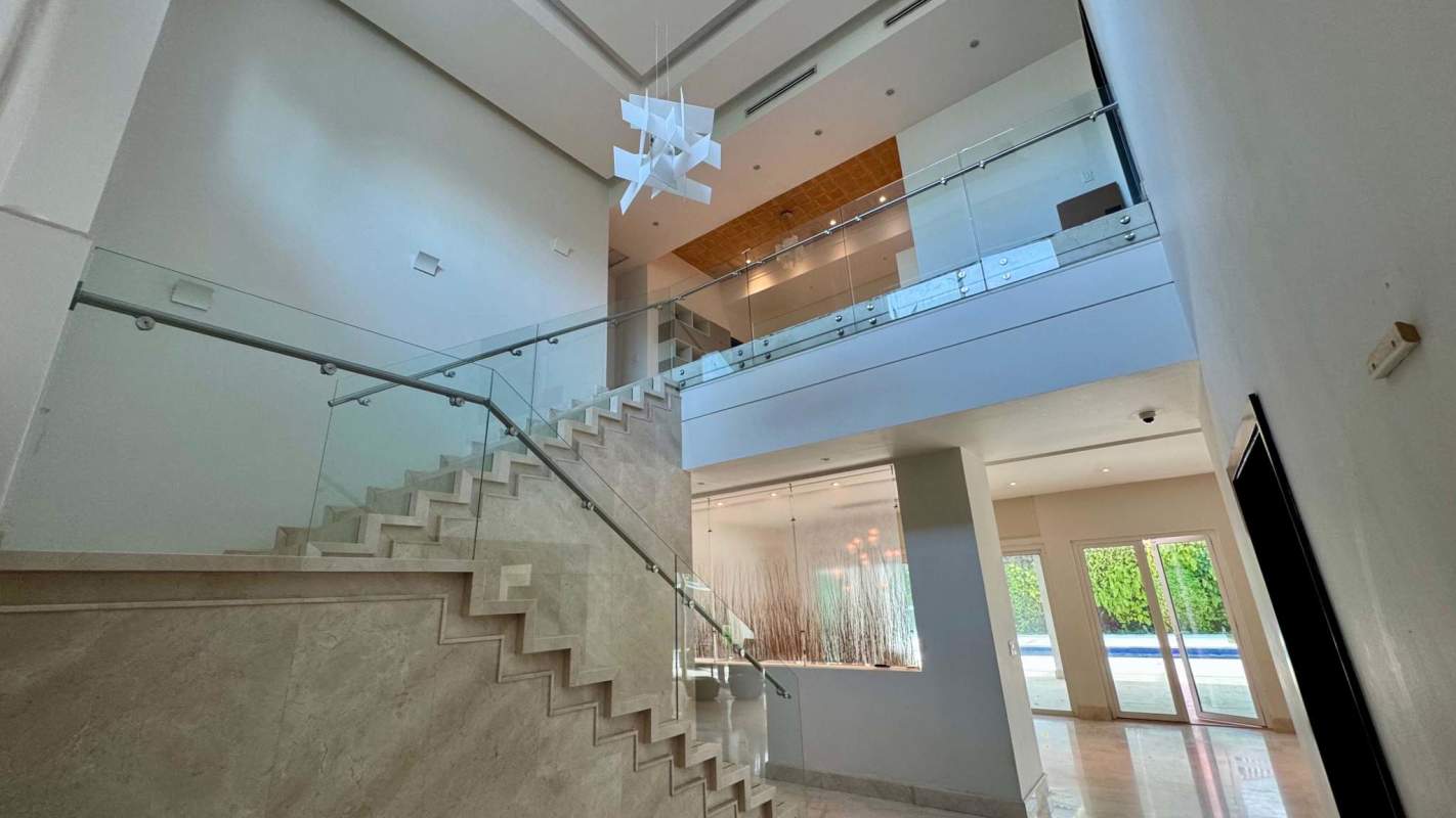 Spacious open plan dining and living room with marble floors, natural light, terrace access at Toscana del Este Panama