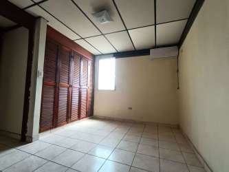 Bathroom with tiled walls and walk-in shower in Vacamonte Panama house