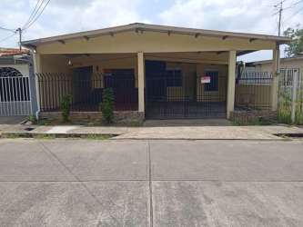 Traditional kitchen with granite countertop and pass-through window in Vacamonte home