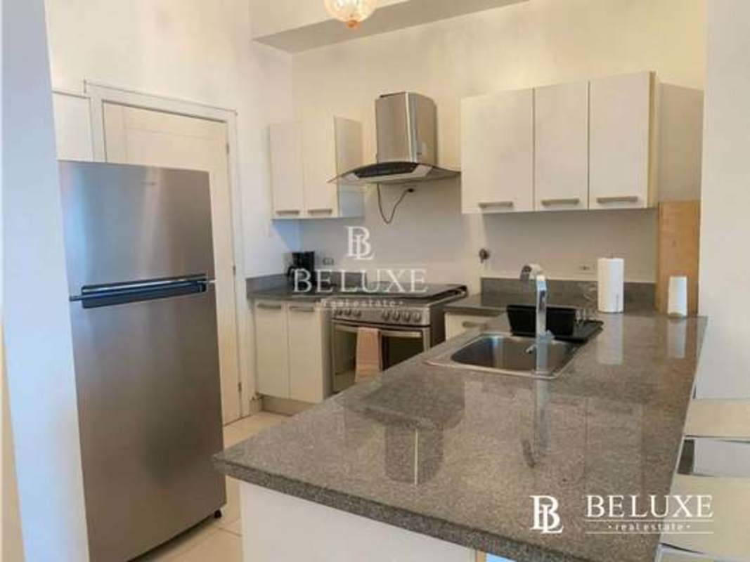 Kitchen with granite countertops, stainless appliances, open layout PH Waters on the Bay Panama