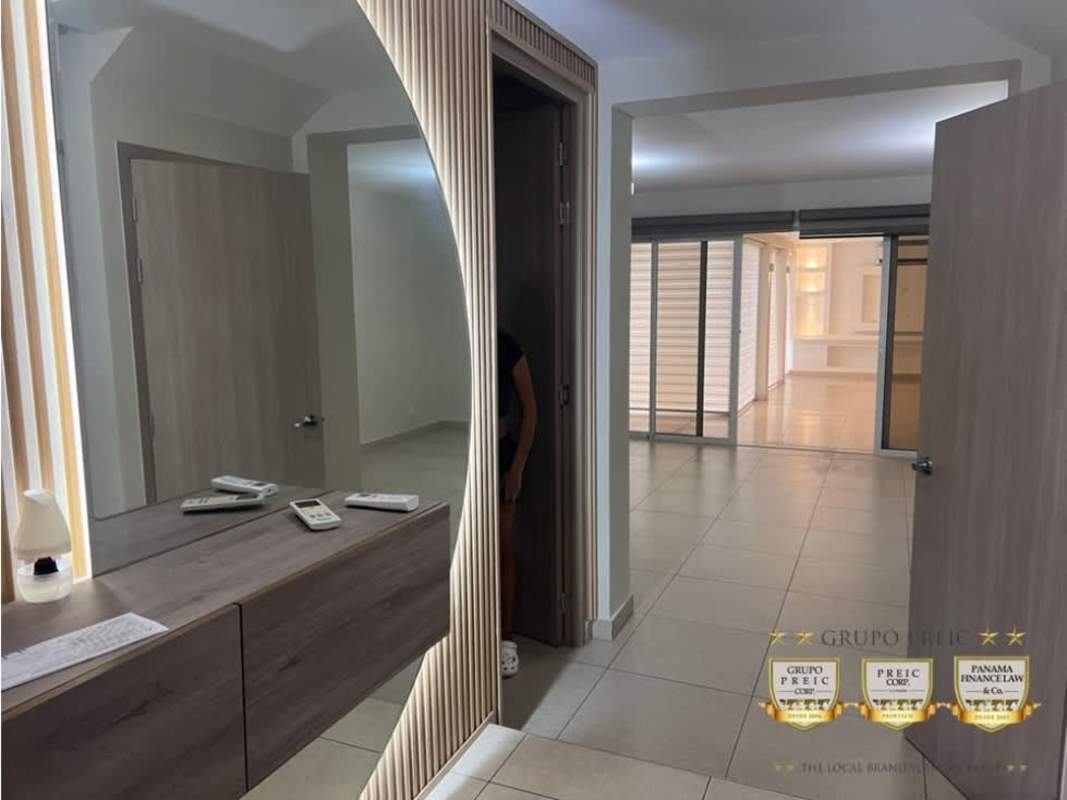 Living area with tile flooring, sliding glass door leading to terrace, modern lighting in Don Bosco Panama City