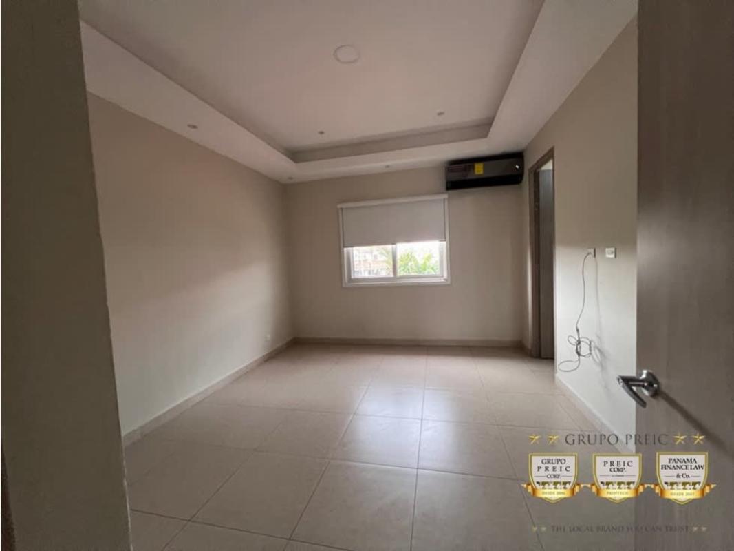 Bedroom with walk-in closet, AC unit, neutral tiles in Reserva de Versalles Don Bosco Panama