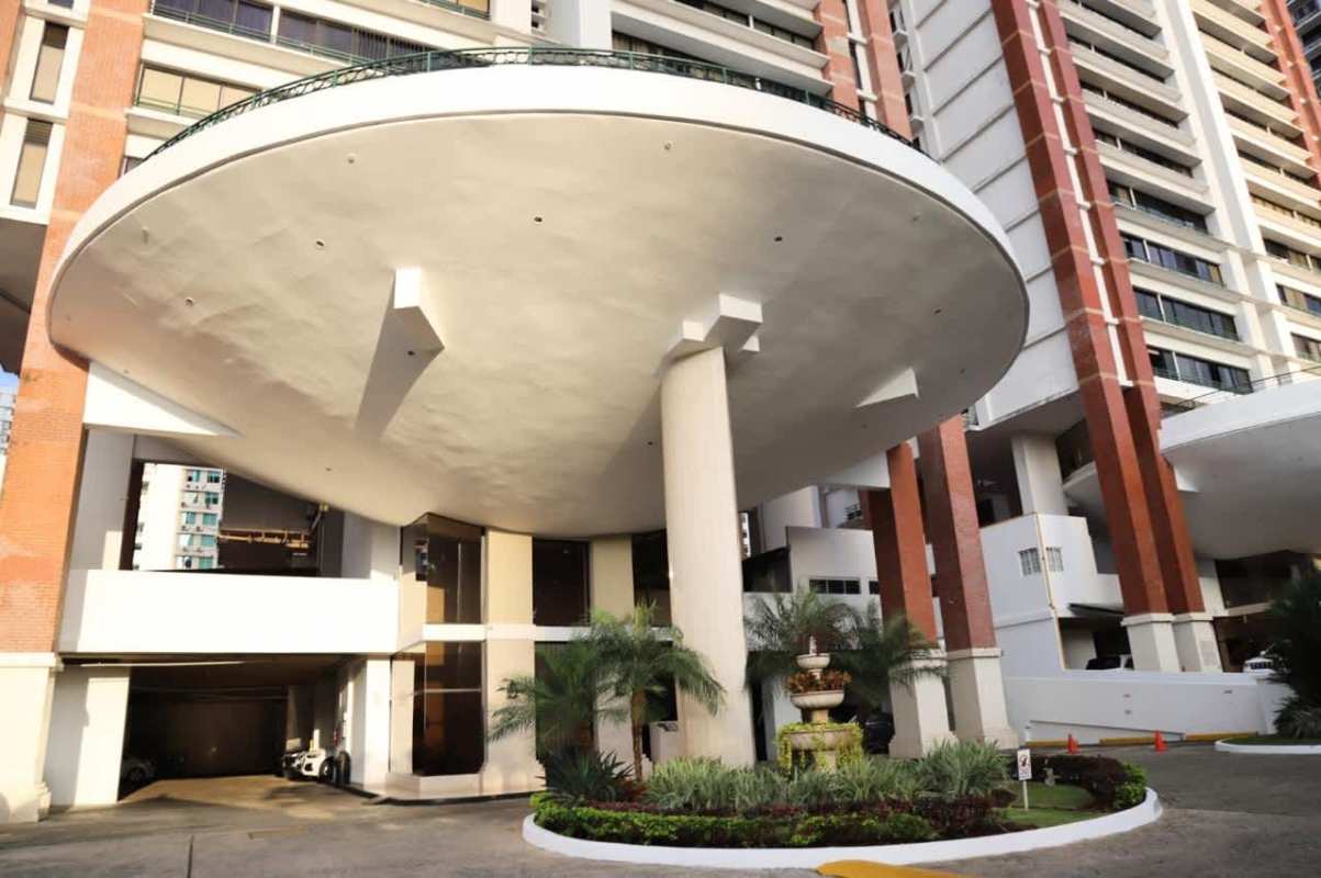 High-rise tower entrance with landscaped garden and covered driveway PH Country Park Panama