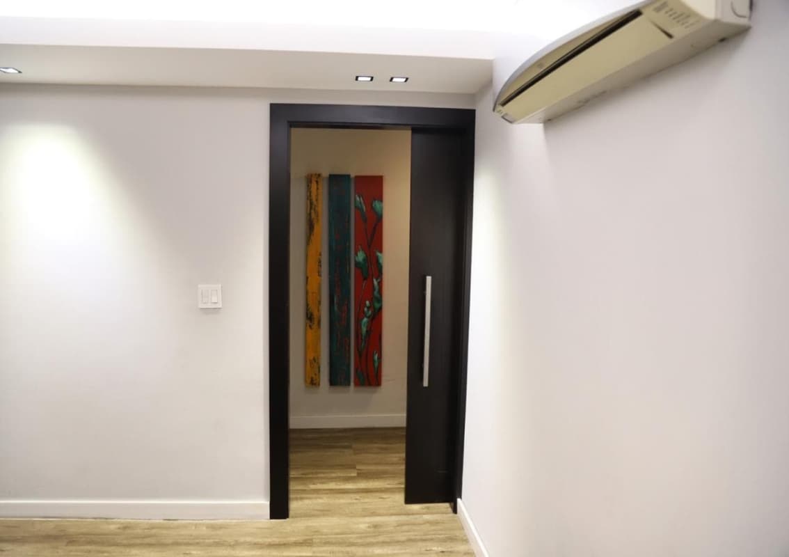 Modern hallway with ceiling lights and wood flooring PH Country Park San Francisco Panama