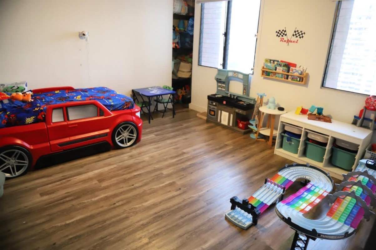 Child's bedroom with toys bright window and wood floor PH Country Park Panama