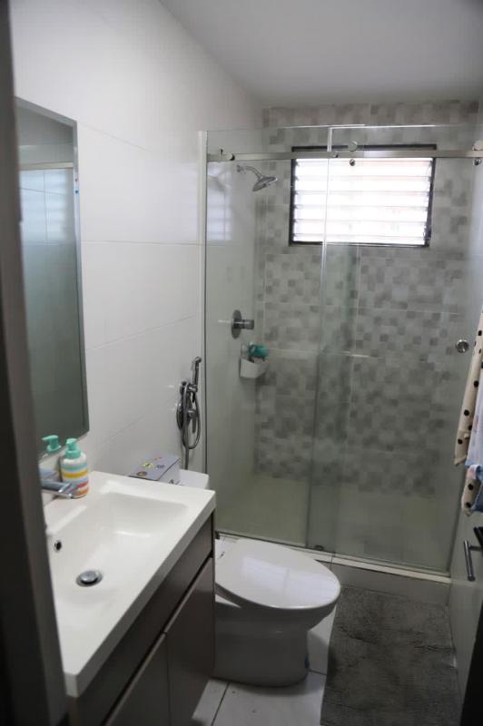 Modern bathroom with walk-in shower glass enclosure in PH Country Park Panama City