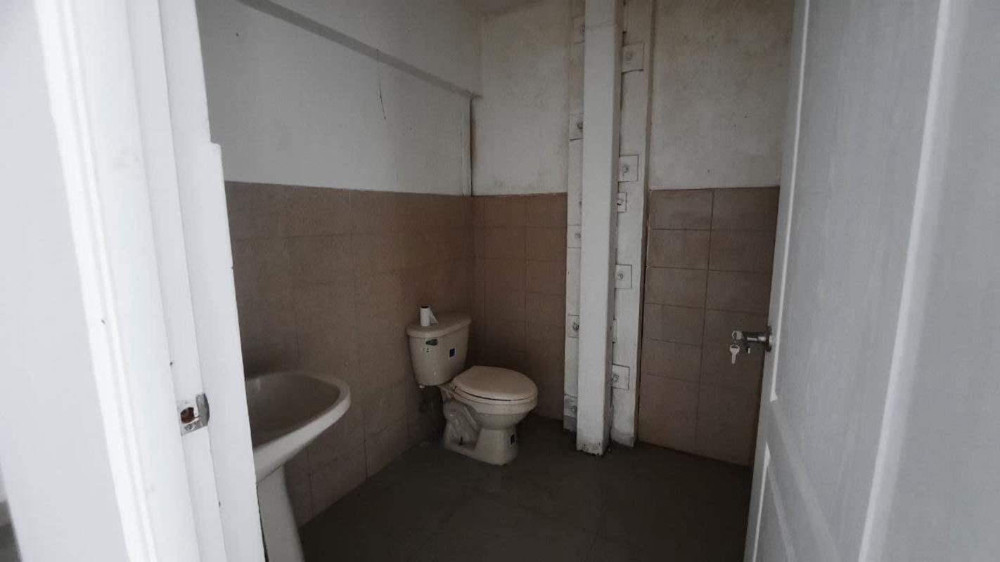 Basic restroom with pedestal sink and toilet in La Gran Estación shopping center Panama