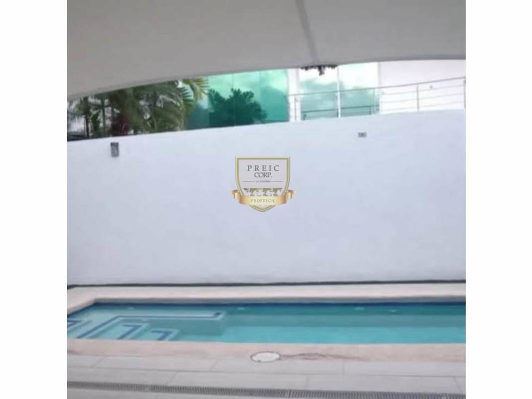 Outdoor private swimming pool with sun deck and privacy wall in Costa Sur Panama house for rent