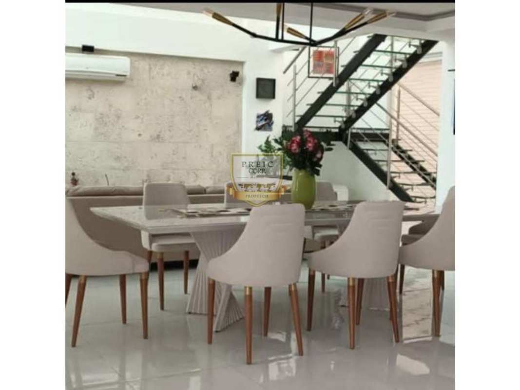 Dining room with marble table, glass staircase, AC Costa Sur Panama house