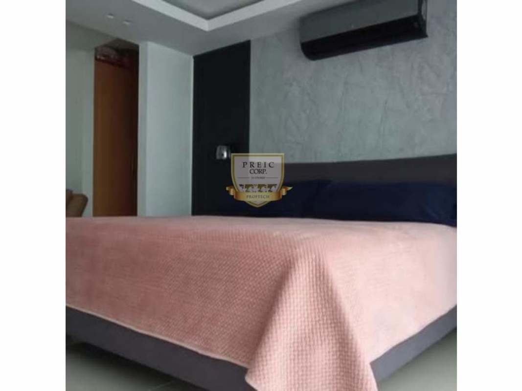 Minimalist modern bathroom with glass shower enclosure in Costa Sur rental house Panama