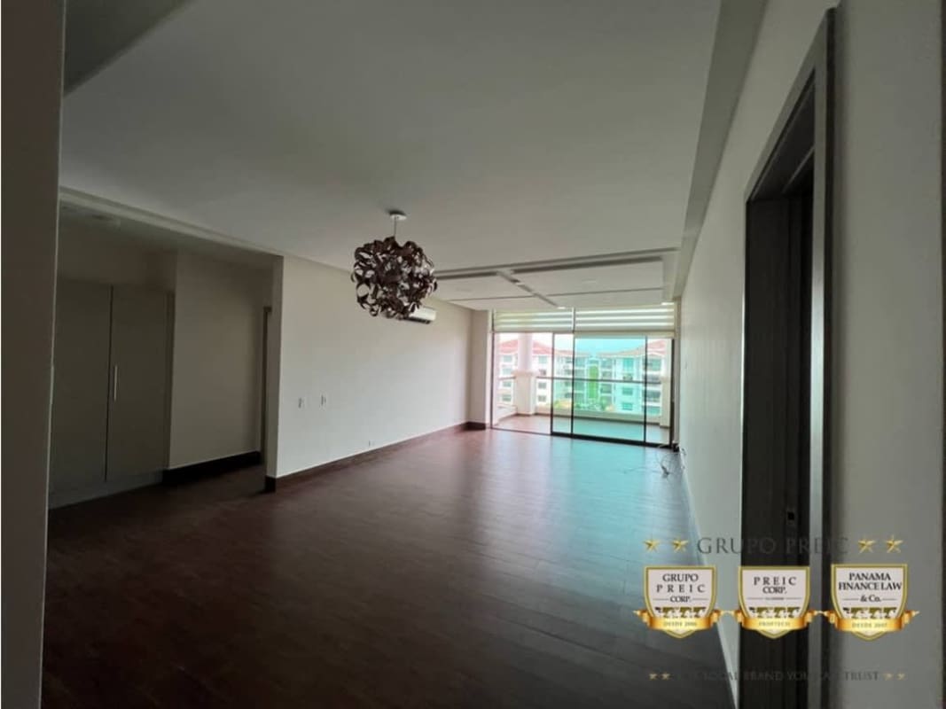 Modern open concept apartment with wood tile floor, dining and kitchen area Costamare Costa Sur Panama