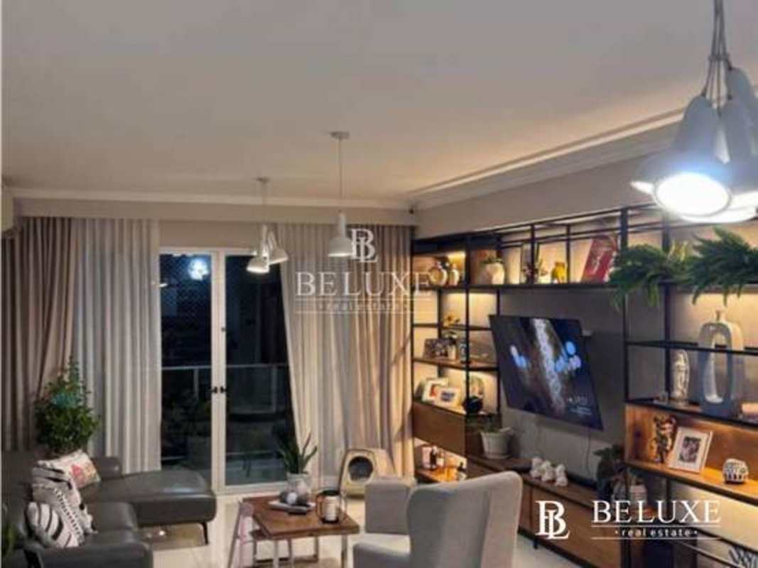 Sectional sofa, pendant lights, balcony access, modern decor in Coco del Mar apartment Panama