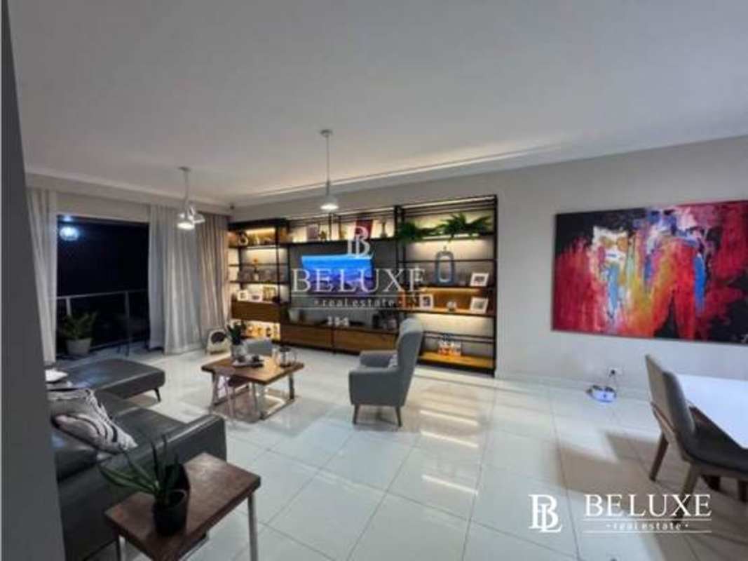 Luxury living room with large shelving, contemporary design, balcony access in Nautica Tower Panama