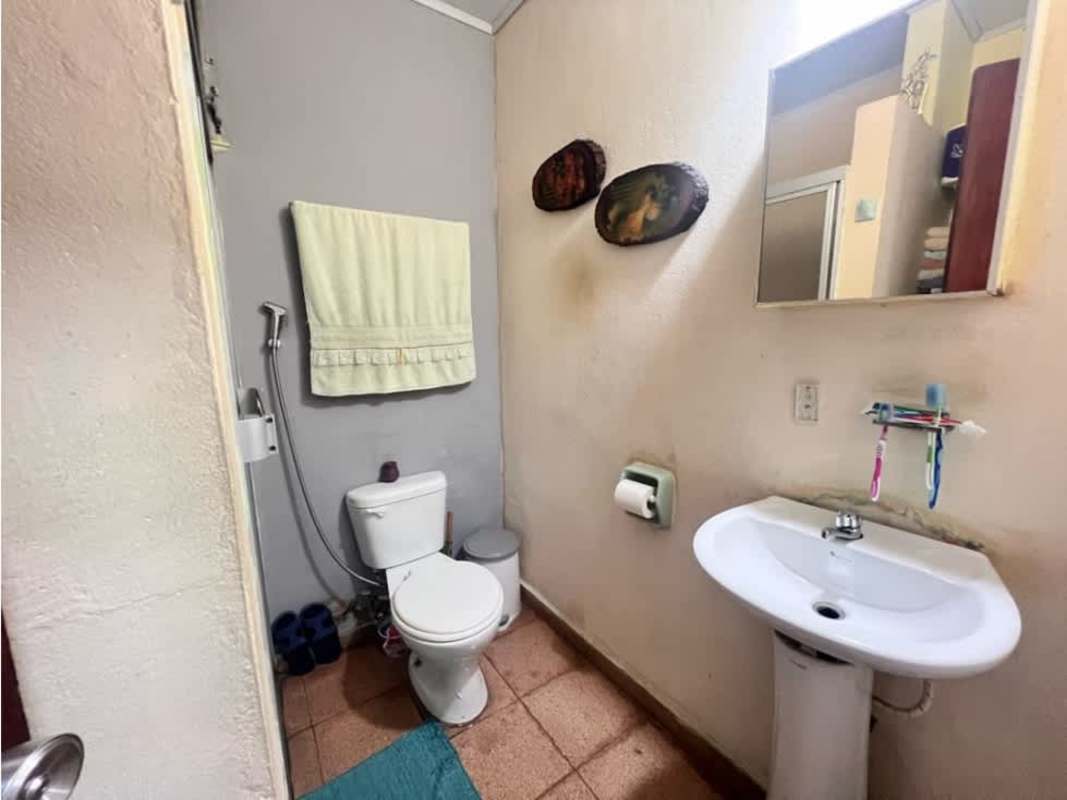 Bedroom with closet, tile floor, bright window with security bars Campo Limberg Panama