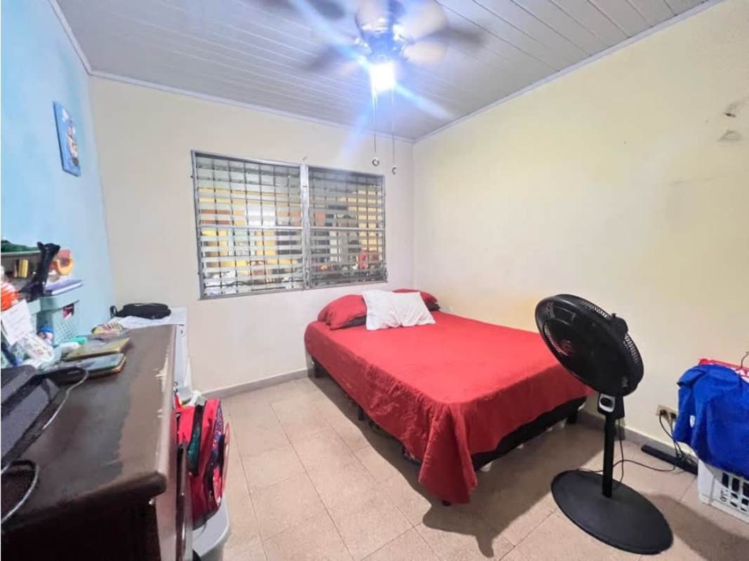 Traditional kitchen with pass-through arch, tile counter, space for appliances Juan Díaz Panama