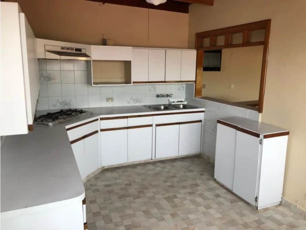 Traditional kitchen with white cabinets, gas stove Betania Panama house for sale